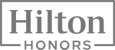 The image shows the logo of Hilton Honors, featuring the text "Hilton Honors" inside a rectangle in a simple, modern font.