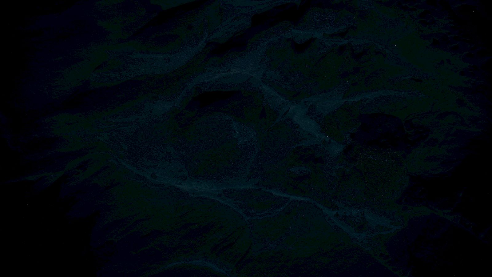 The image appears to be very dark with indistinct patterns or textures, possibly abstract or obscured details.