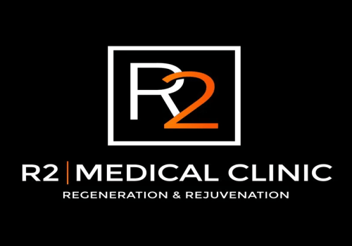 R2 Medical Clinic logo with an &ldquo;R2&rdquo; emblem and tagline &ldquo;Regeneration & Rejuvenation&rdquo; on a black background.