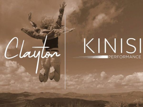 Two people are jumping energetically against a cloudy sky backdrop with "Clayton Kinisi Performance" text overlaid.